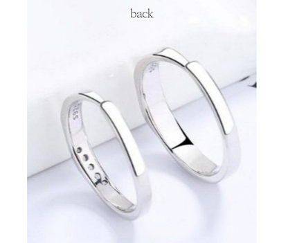 BAMUU couple ring set showcasing 14K rhodium plated his and hers rings from the back view.